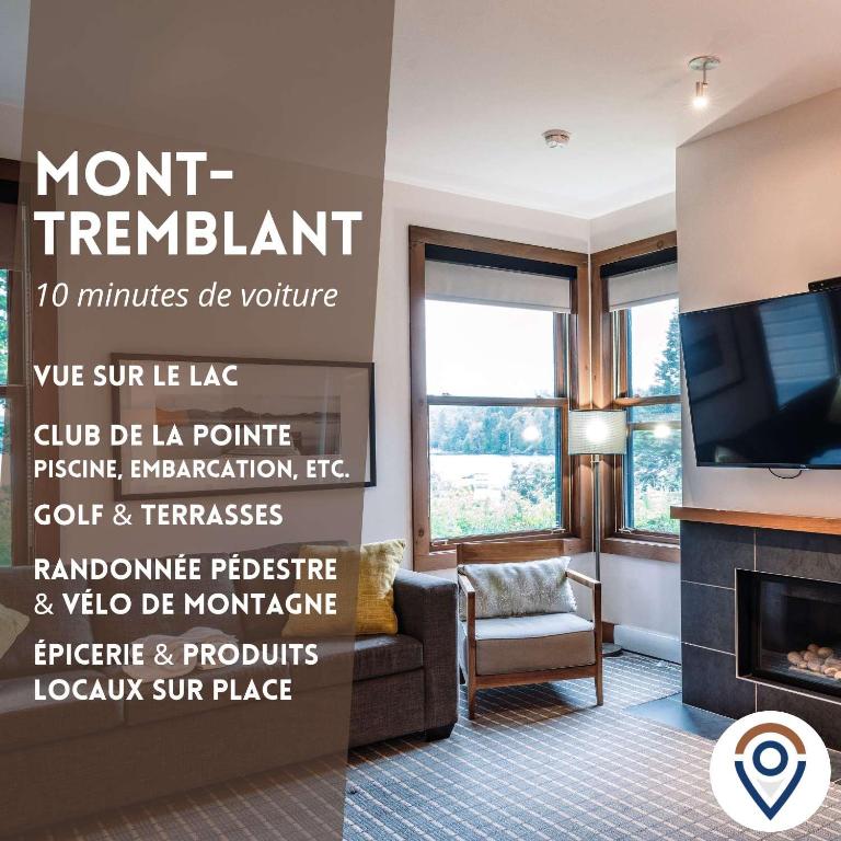 a living room with a fireplace and a tv at Lakefront Mountain View - Resort Studio in Lac-Superieur