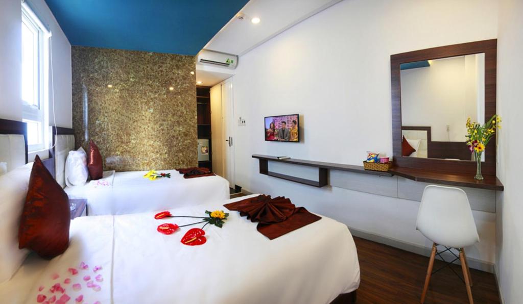 Postel nebo postele na pokoji v ubytování Rich Hotel