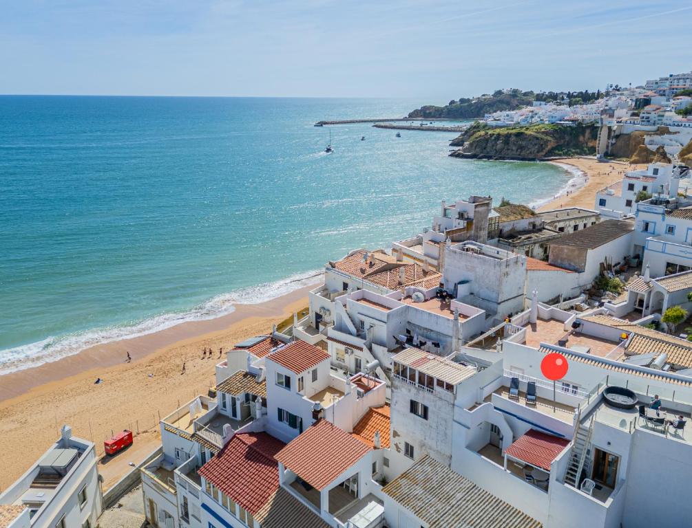an aerial view of a beach and buildings at Vista del Mar Guest House in Albufeira