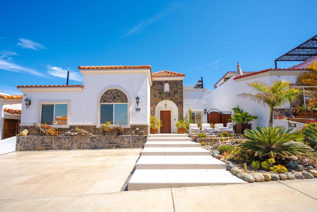 a villa with a pathway leading to a house at Villa Coral 3 BR 3BA with pool in Primo Tapia