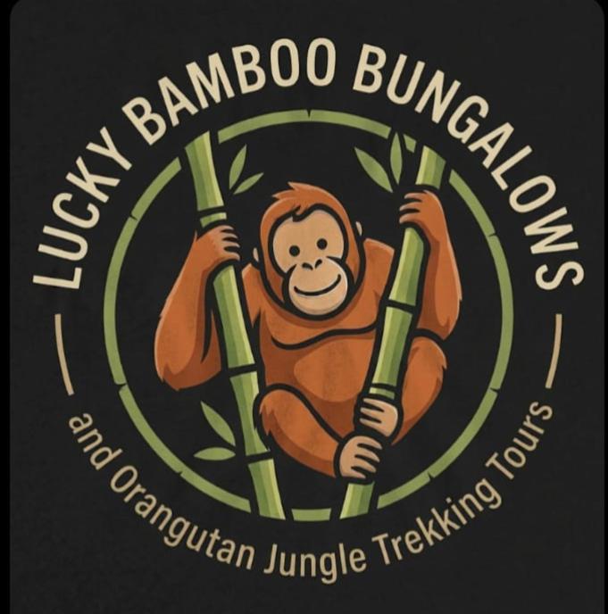 a monkey on a black shirt with the words new banana bungee istg istg at Lucky Bamboo'Bungalows and Orangutan Jungle Trekking Tours in Bukit Lawang