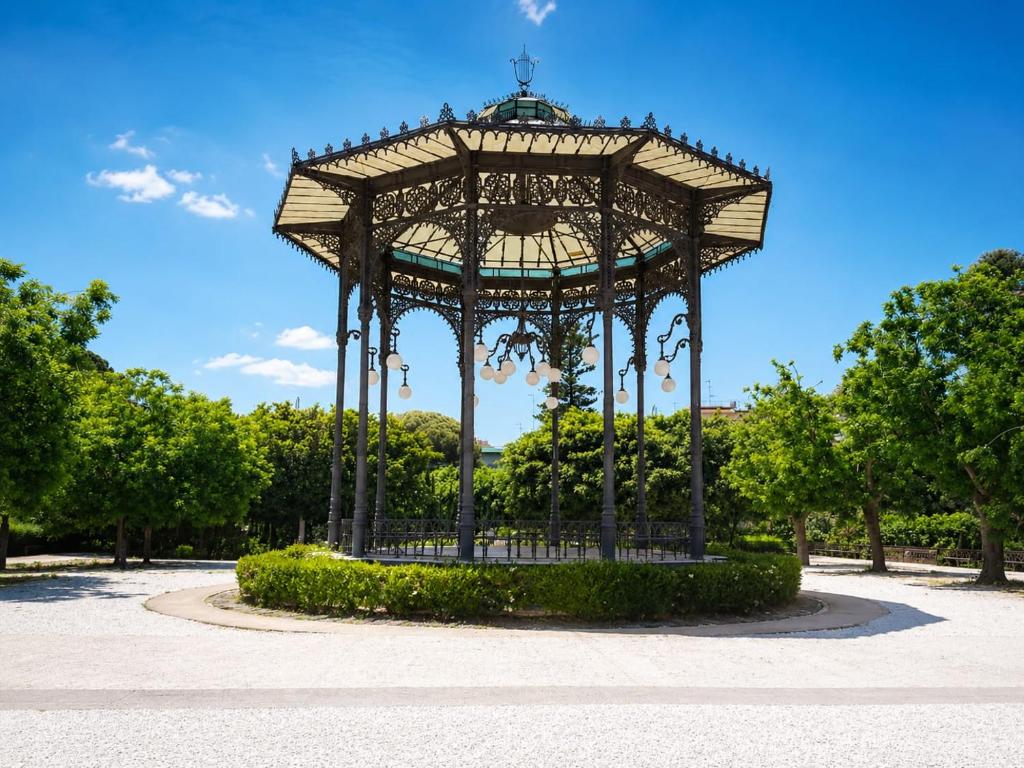 a large gazebo in a park with trees at Guglielmo room's B&B in Catania