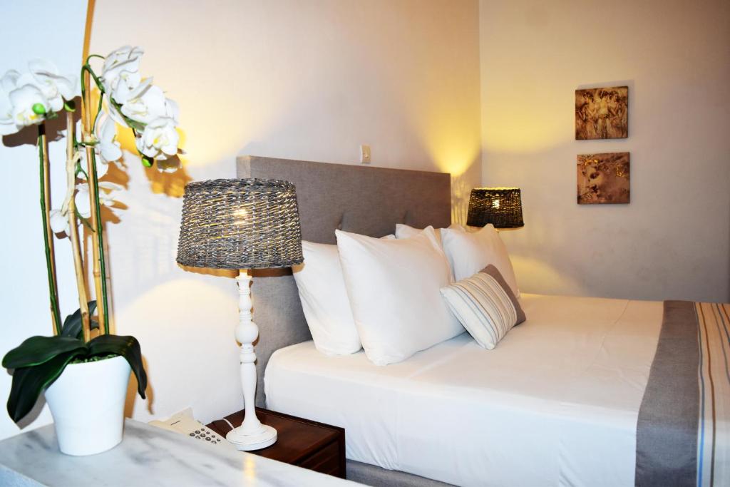 Postel nebo postele na pokoji v ubytování Astron Hotel