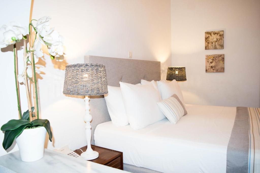 Postel nebo postele na pokoji v ubytování Astron Hotel