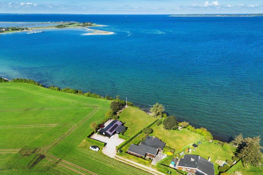 an aerial view of a house and the ocean at FY418-Faaborg-Fruerlund-48 in Faaborg