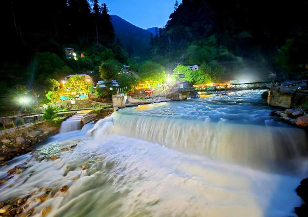 a picture of a waterfall at night at The Cozy Cottage in Kundālshai