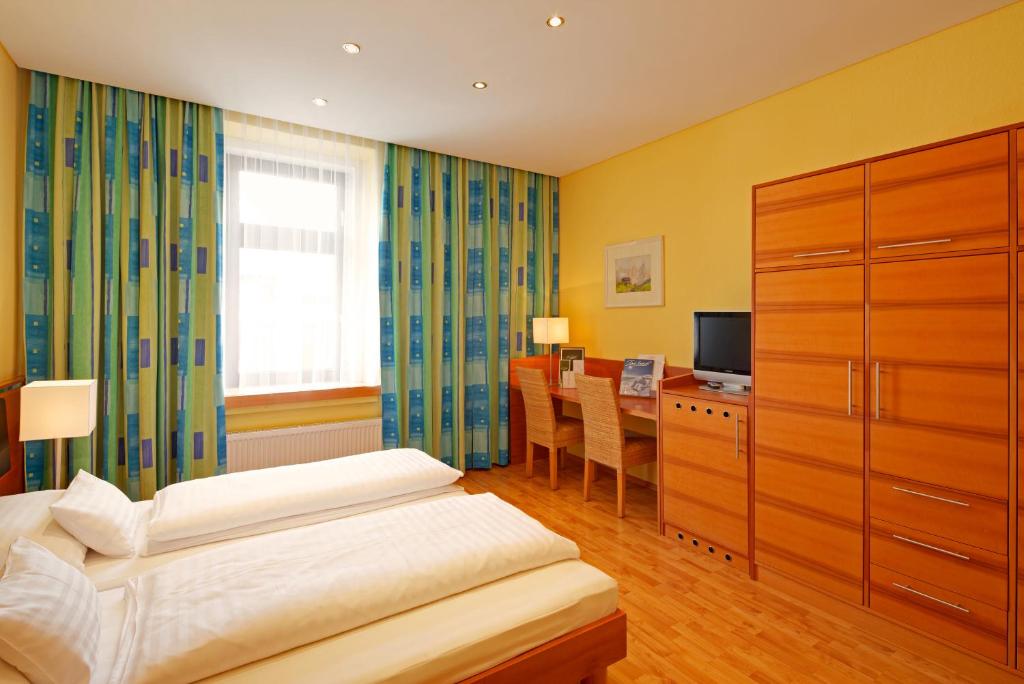 Postel nebo postele na pokoji v ubytování Hotel Central