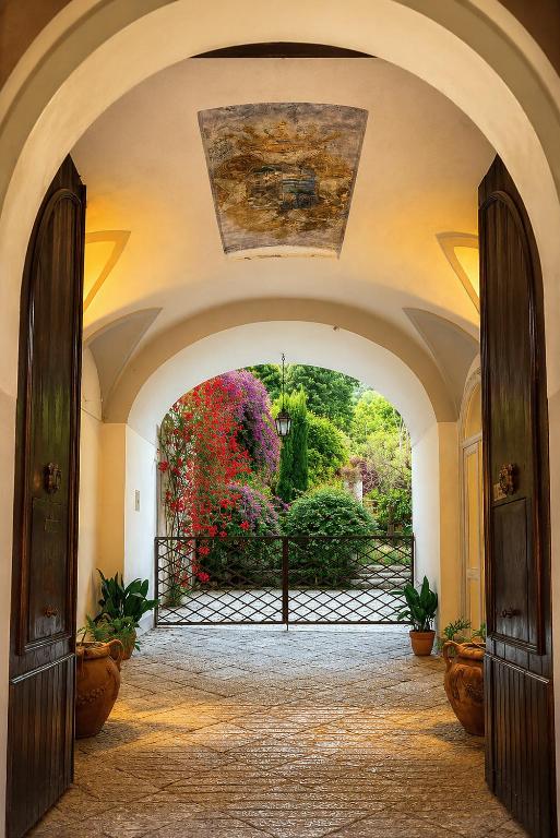 an archway with an entrance to a garden at Palazzo Murat Luxury Rooms in Arienzo San Felice
