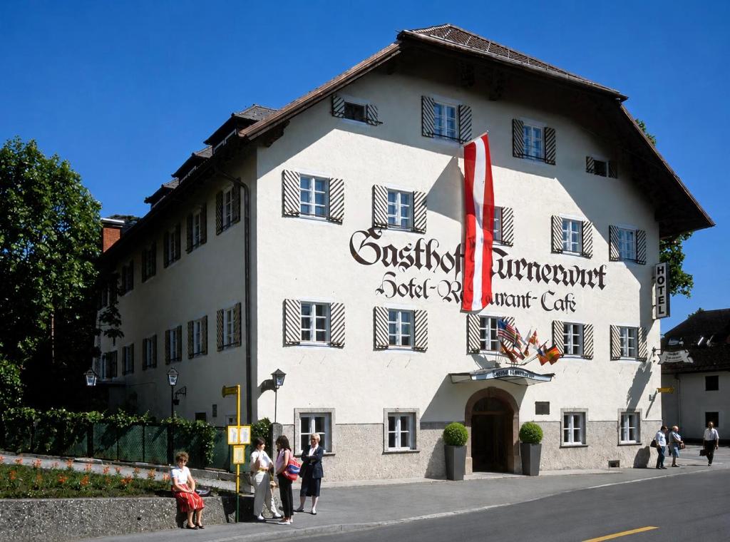 a group of people standing outside of a building at Hotel Turnerwirt in Salzburg