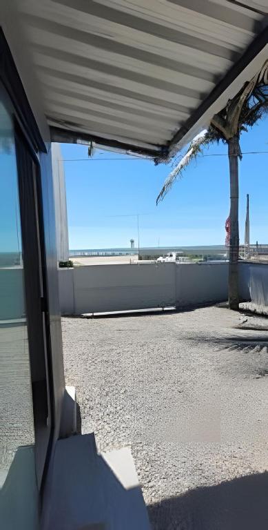 a view of a building with a view of the ocean at Cantinho Charmoso Pertinho do Mar in Navegantes