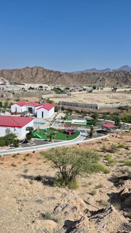 an aerial view of a small town in the desert at Jory Hatta Resort - منتجع جوري حتا in Hatta