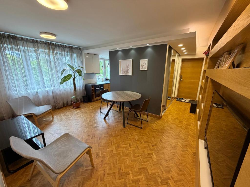 a living room with a table and chairs at Old Town Apartment in Võru