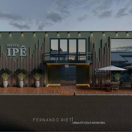 a rendering of a building with a balcony and a patio at Hotel Ipê in São Luís Gonzaga