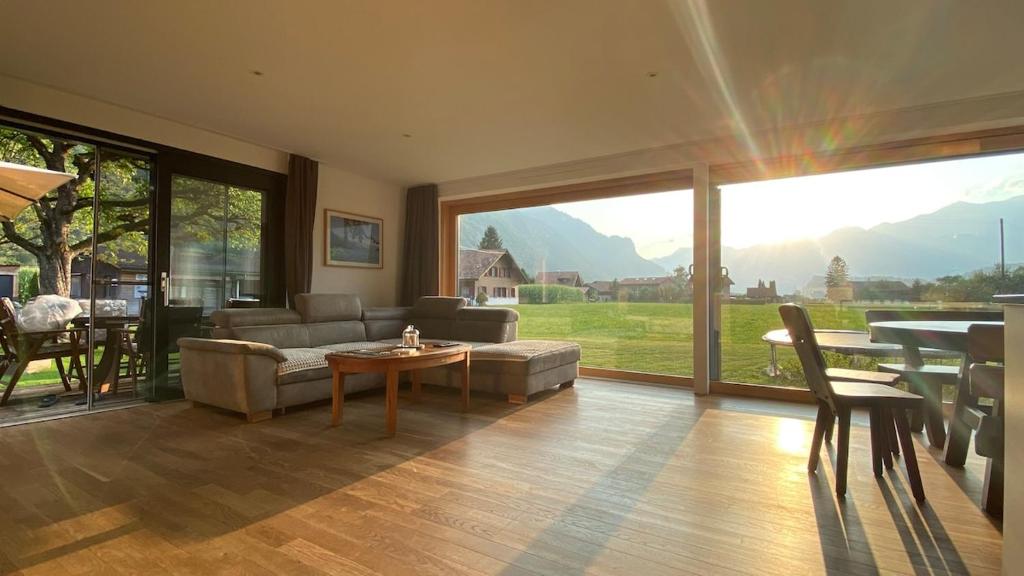 a living room with a couch and a table at Falke-Apart 1 am Wasserfall in Unterbach