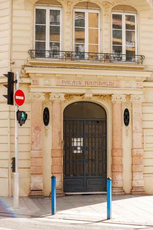 a building with a large black door on a street at Simple Stay - Fresh Start May 2026 in Nice