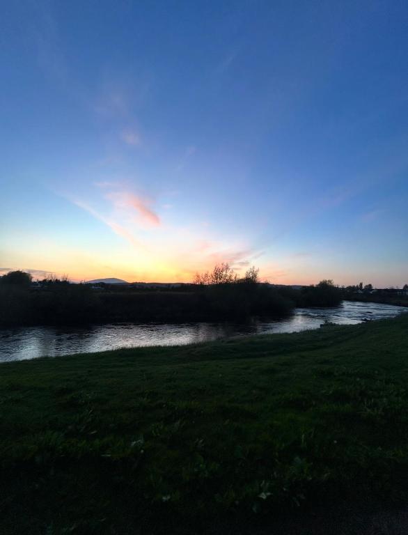 a view of a river at sunset at Simple Stay Foxford in Foxford