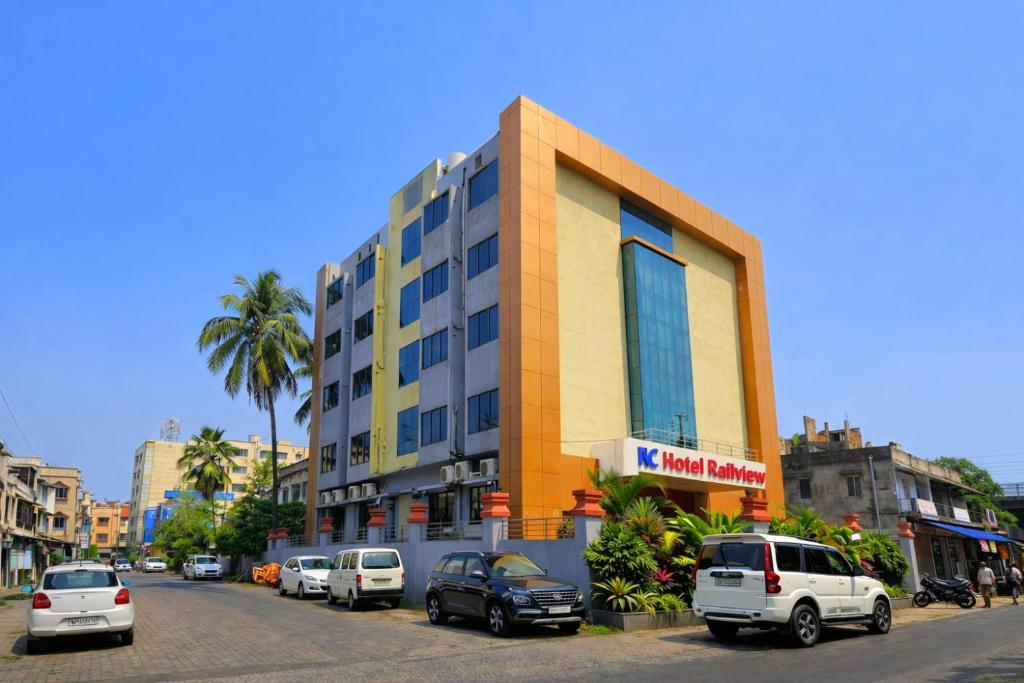a building on the side of a street with parked cars at RAILVIEW HOTEL- Nr Platform-1, Railway Station in Bhubaneshwar
