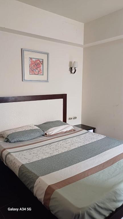 a large bed in a bedroom with at Marassi in El Alamein