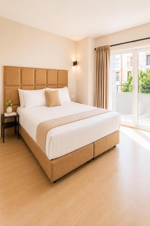 a bedroom with a large bed and a window at Blanca Maris in Fuengirola