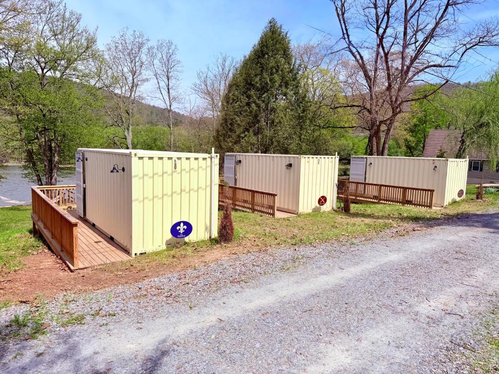 a row of portable toilets on the side of a road at Romantic Riverfront Retreat in Sugar Run