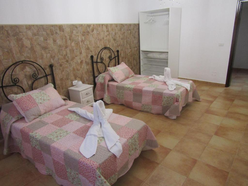 Posteľ alebo postele v izbe v ubytovaní La Casita Villalba