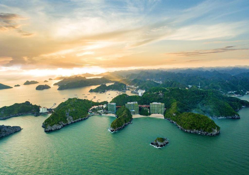 a group of islands in the water at sunset at 1404, Building 1, Ocean Sky Forest - Flamingo Cat Ba in Cat Ba