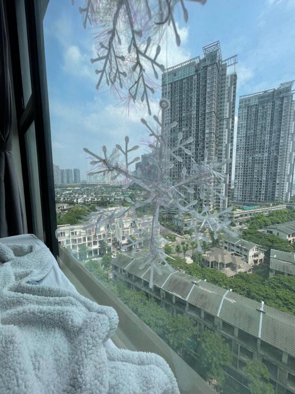 a view of a city from a window at Canary Nest Solforest Ecopark Homestay in Kim Quan
