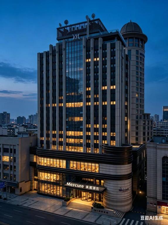 a large building with a sign on top of it at Mercure Dalian City Center in Dalian
