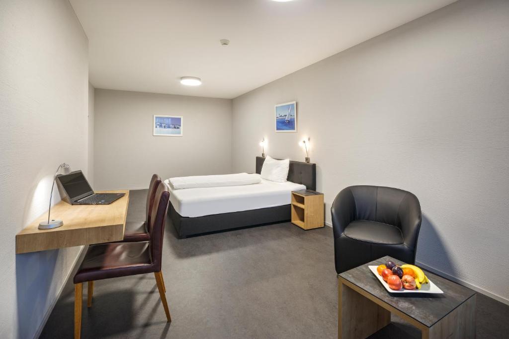 Postel nebo postele na pokoji v ubytování Aparthotel-aarau-WEST Swiss Quality