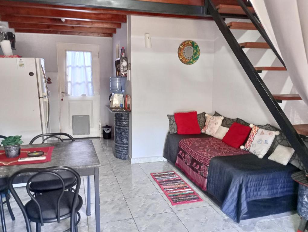 a living room with a couch and a table at La Casa de Sol in Posadas