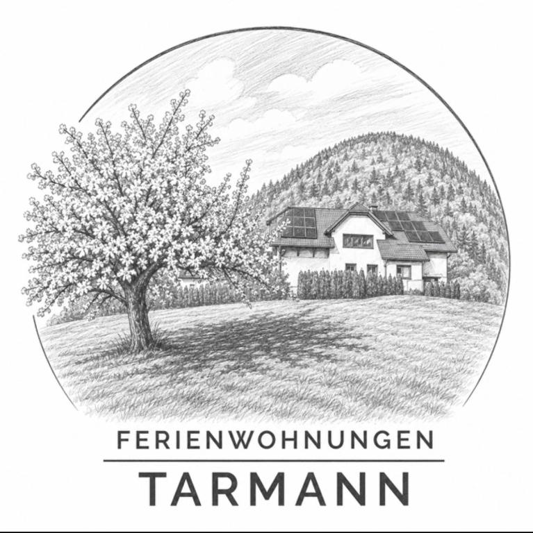 a black and white picture of a house and a tree at Ferienwohnungen Tarmann in Bodensdorf