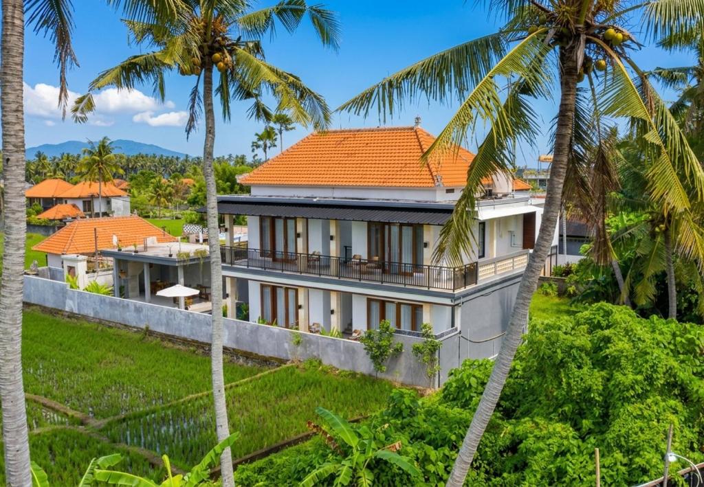 an aerial view of a house with palm trees at Bale Sidi House Ubud in Ubud