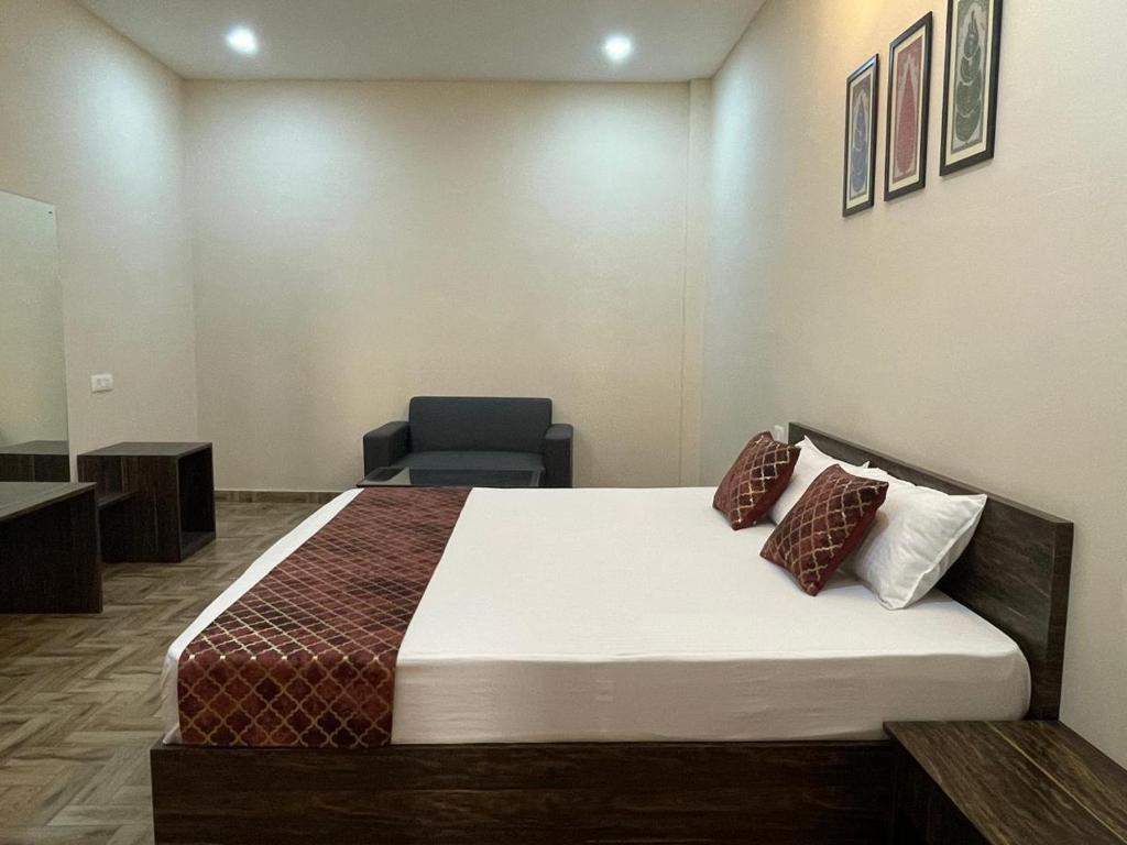 a hospital room with a bed and a chair at Vistara courtyard in Varanasi