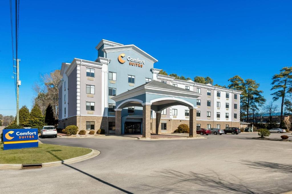 a rendering of a hotel with a parking lot at Comfort Suites Sanford in Sanford