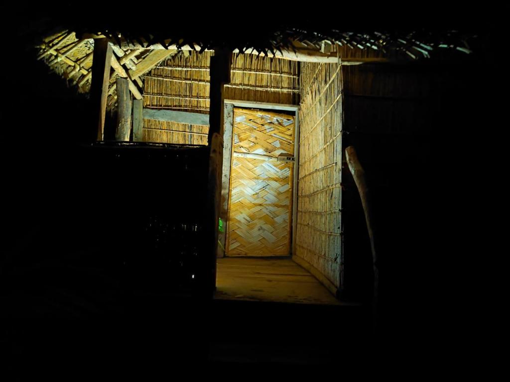 a door in a brick building with at Montanna bungalow in Lénakel