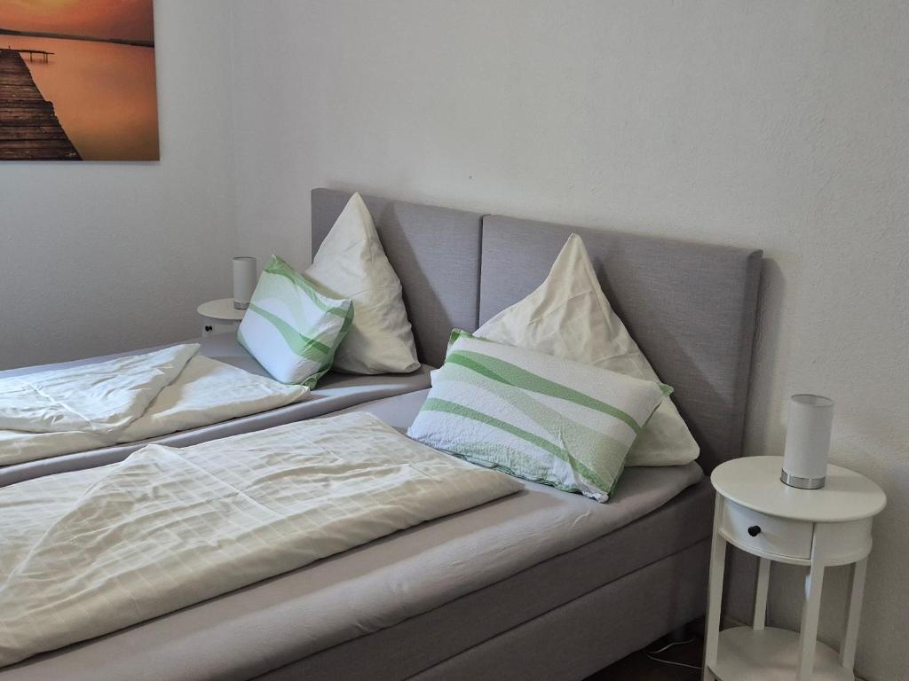 a couch with pillows on it in a room at Hotel Restaurant Bauernstube in Eschenburg