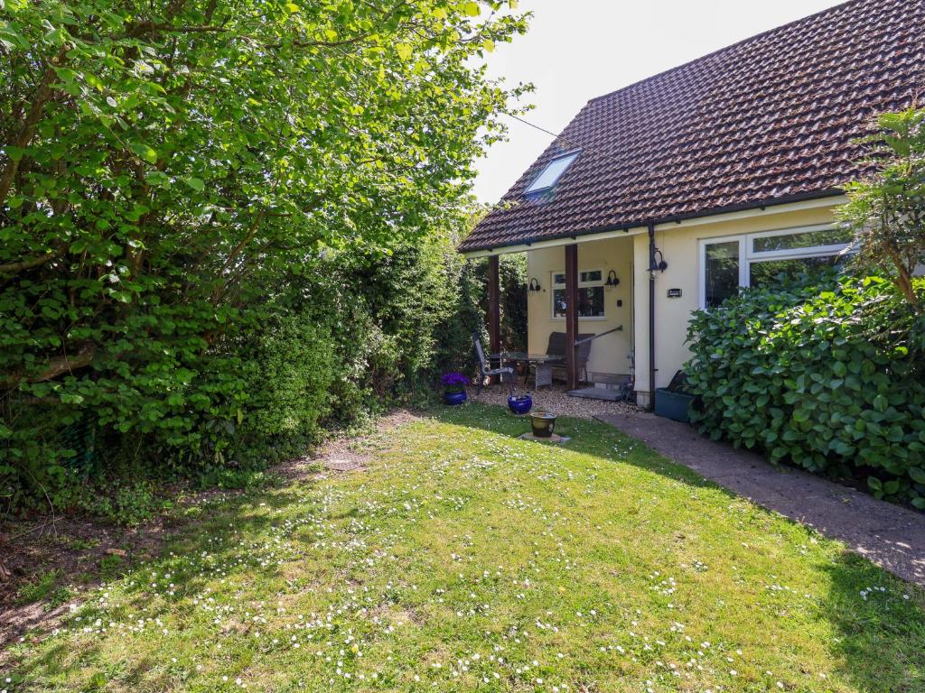 a house with a yard in front of it at Rosemarie Annexe in Axminster