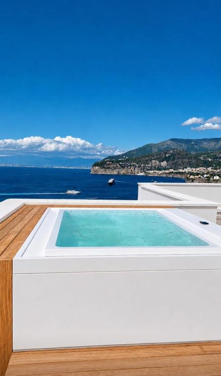 a swimming pool on the roof of a house at Villa Coralia Sorrento, Luxury Suite in Amalfi Coast, Italia in Sorrento
