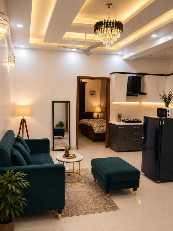 a living room with a couch and a bed at Casa Nova Stays in Dehradun