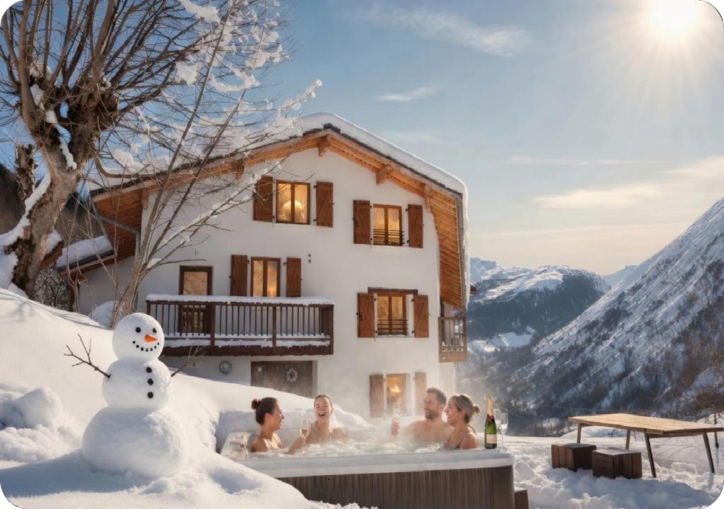 a group of people in a hot tub in the snow at Chalet Broski - Spacious Chalet with Hot Tub, Sauna & BBQ in Planvillard