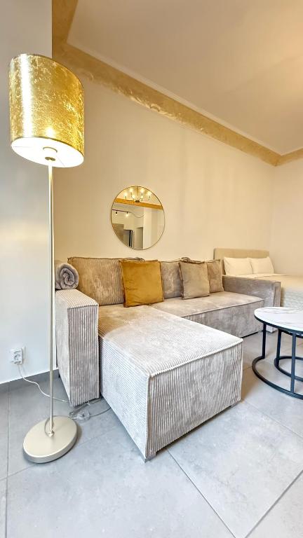 a living room with a couch and a table at Home Apartments Five in Wuppertal
