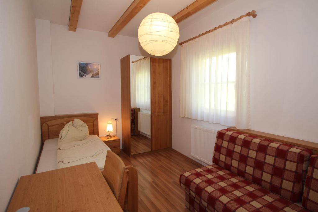 A bed or beds in a room at Apartments Im Winkl
