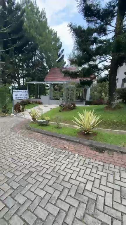 a brick driveway in front of a house at villa NC3 31 Kota Bunga in Cikundul