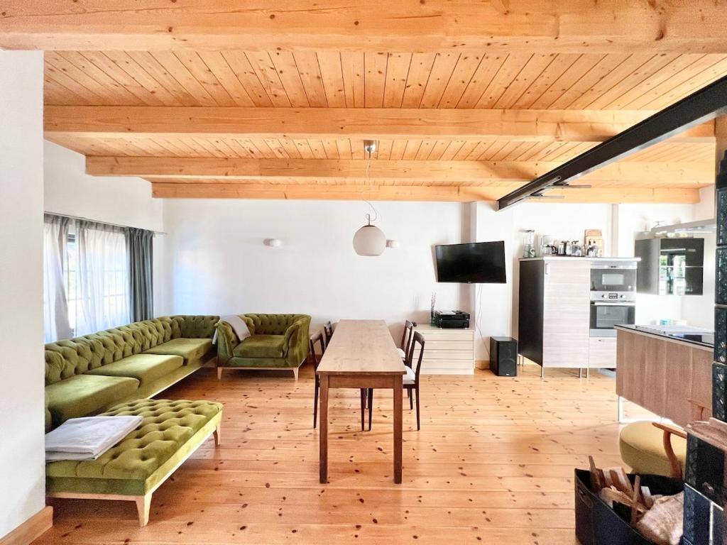 a living room with a couch and a table at Kachelofenhaus in Fehmarn