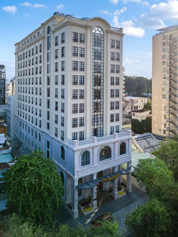 a large white building with a lot of windows at Tao Dan Hotel in Ho Chi Minh City