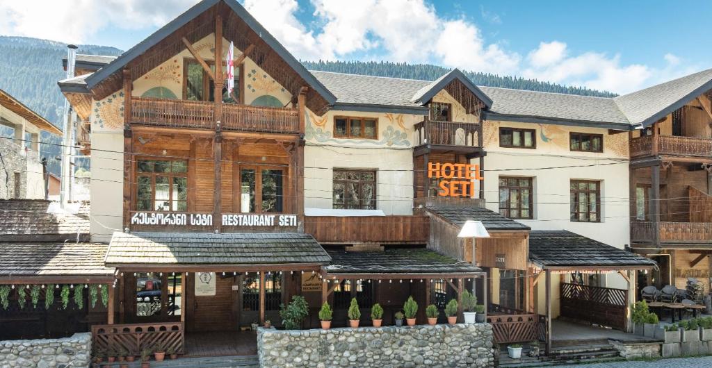 a large building with akritkritkritkritkritkritkritkritkritkritkrit at Seti Mestia Hotel in Mestia