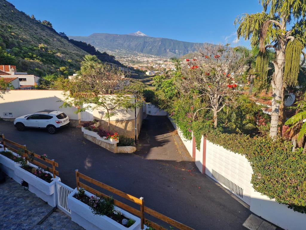 a car parked in a parking lot next to a fence at Chalet JULI Mirador in Puerto de la Cruz