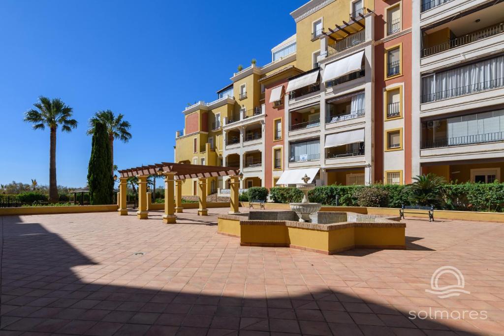 a park in front of a building at Playa Grande SOLMARES in Isla del Moral