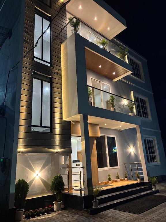 a house with lights on the side of it at Hotel DG Residency in Guwahati