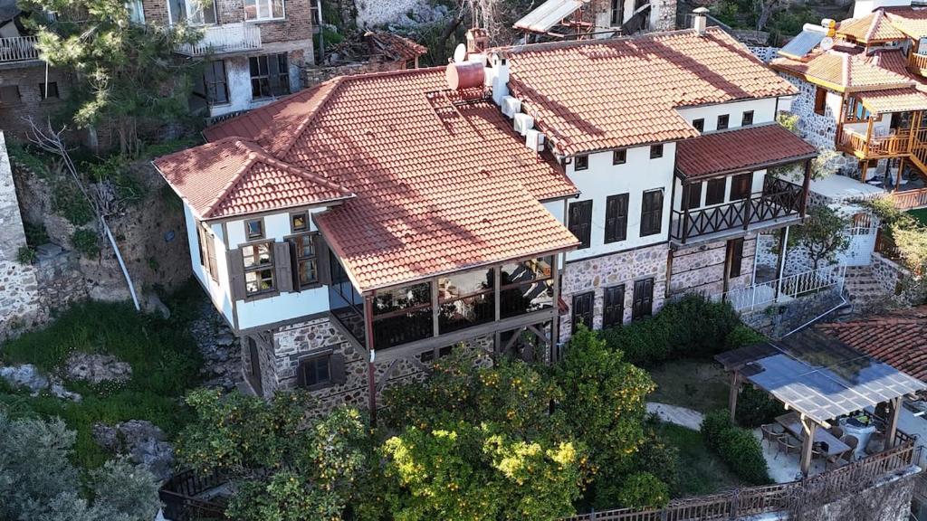 an overhead view of a large house with red roof at Villa Historyka in Alanya